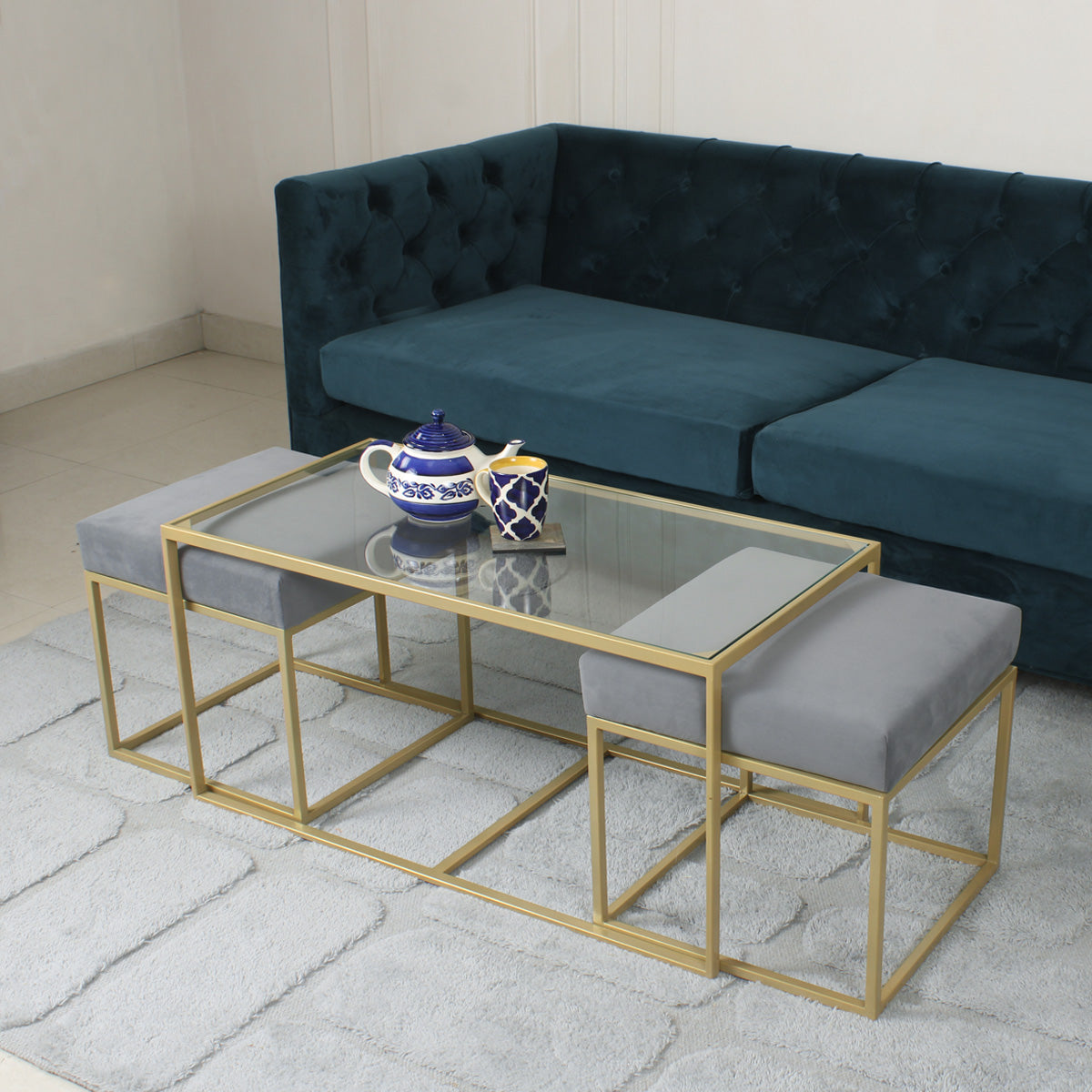 BeanBistro Clear Glass Coffee Table Set With 2 Stools In Gold Finish